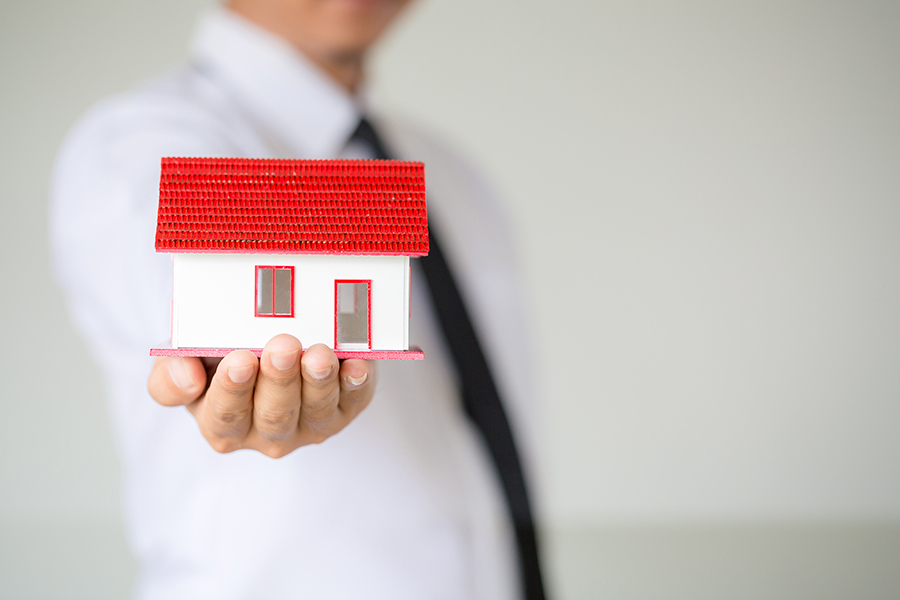 businessman-holding-model-house.jpg