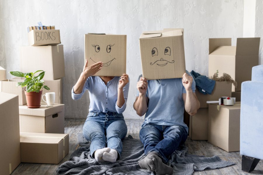 silly-couple-home-moving-day-with-boxes-head.jpg